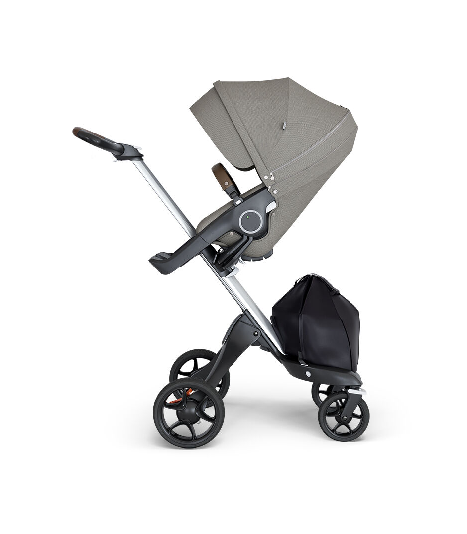 Stokke® Xplory® wtih Silver Chassis and Leatherette Brown handle. Stokke® Stroller Seat Seat Brushed Grey.